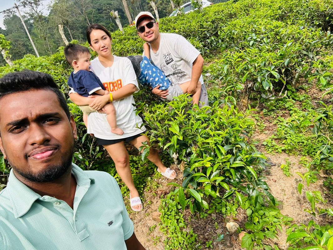 A family exploring the lush green tea estates of Ella and Nuwara Eliya with a private guide.