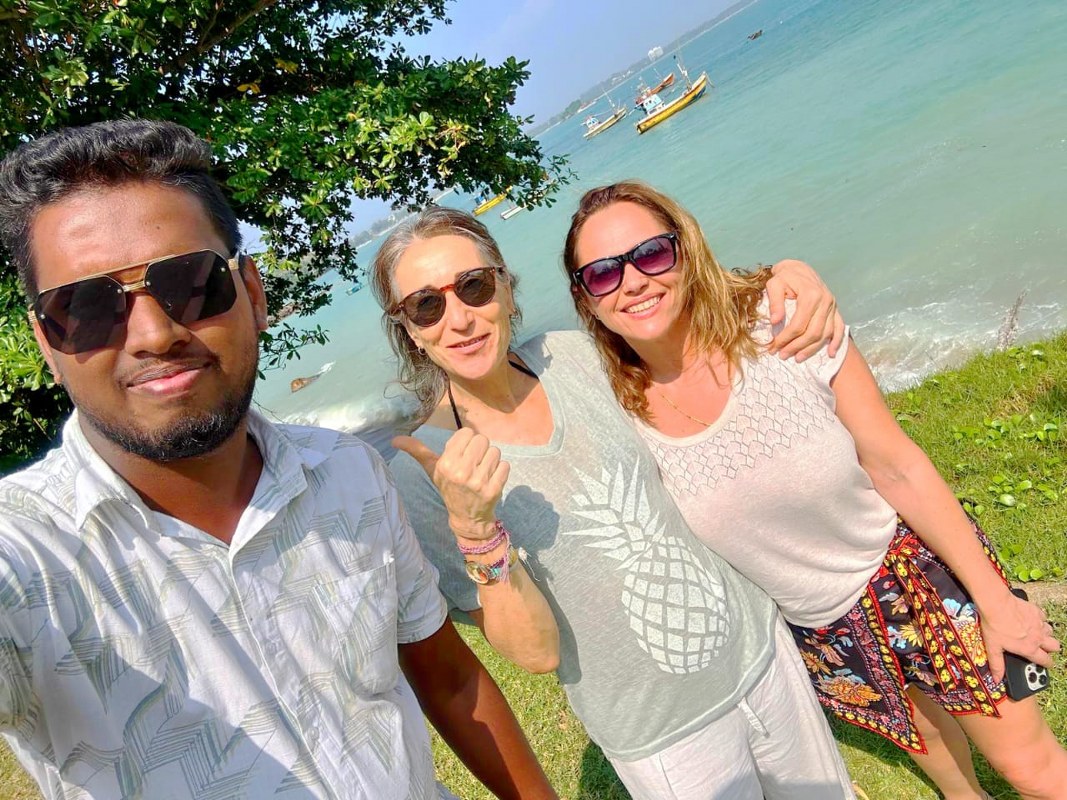 Tourists enjoying the tropical South Coast beaches in Mirissa during a Go Ceylon Travel tour.
