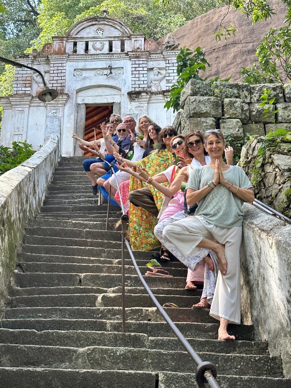 Spiritual yoga and meditation retreat for a group of travelers at a Sri Lankan temple.